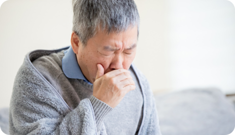 苦しそうな男性